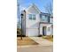 Attractive two-story home showcasing light gray siding, a one-car garage, and a well-maintained front lawn at 9142 Widden Way, Charlotte, NC 28269