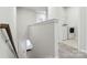 Bright hallway leading to laundry room features neutral paint and carpeted floor at 9142 Widden Way, Charlotte, NC 28269