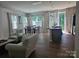 Open floor plan with living room, dining area, and a modern island in the kitchen at 9142 Widden Way, Charlotte, NC 28269