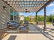 Outdoor patio with wicker furniture and shade structure at 1001 Hampton Grove Rd, Waxhaw, NC 28173