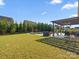 Spacious backyard featuring a pergola, seating, and well-maintained lawn at 1001 Hampton Grove Rd, Waxhaw, NC 28173