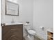 Bathroom featuring a sleek vanity, modern fixtures, and a toilet at 1001 Hampton Grove Rd, Waxhaw, NC 28173