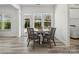 Cozy breakfast nook features a white table and chairs with backyard access at 1001 Hampton Grove Rd, Waxhaw, NC 28173
