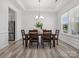 Dining room features hardwood flooring, a stylish chandelier, stainless steel appliances and wainscotting at 1001 Hampton Grove Rd, Waxhaw, NC 28173