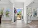 Bright foyer featuring a welcoming open door, hardwood flooring, and elegant molding at 1001 Hampton Grove Rd, Waxhaw, NC 28173