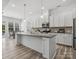 Modern kitchen with granite counters, white cabinetry, stainless steel appliances, and eat-in breakfast area at 1001 Hampton Grove Rd, Waxhaw, NC 28173