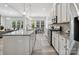 Bright kitchen features granite countertops, stainless steel appliances, and a large central island at 1001 Hampton Grove Rd, Waxhaw, NC 28173