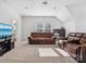 Spacious living room with two brown couches, neutral colored carpet and lots of light at 1001 Hampton Grove Rd, Waxhaw, NC 28173