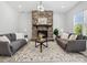 Inviting living room with stone fireplace, plush seating, and ample natural light at 1001 Hampton Grove Rd, Waxhaw, NC 28173