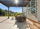 Covered patio with dining set offers a relaxing outdoor living space at 1001 Hampton Grove Rd, Waxhaw, NC 28173