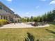 Relaxing pool area with lounge chairs and adjacent covered patio at 1001 Hampton Grove Rd, Waxhaw, NC 28173