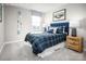 Inviting bedroom features a bed with plaid comforter, bedside table, and natural light at 10116 Florentine Way, Charlotte, NC 28214