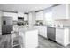Bright kitchen with white cabinets, stainless steel appliances, granite countertops, and hardwood floors at 10116 Florentine Way, Charlotte, NC 28214