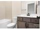 Well-lit bathroom featuring a tub and a modern vanity with dark cabinets and light countertop at 1059 Sage Pine Cir, Clover, SC 29710