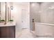 Modern bathroom featuring a large, tiled shower with glass enclosure, double vanity and neutral color palette at 1059 Sage Pine Cir, Clover, SC 29710