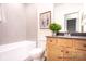 Bathroom features wood vanity, neutral paint, and combination tub and shower with tile surround at 1059 Sage Pine Cir, Clover, SC 29710