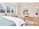 Relaxing bedroom with large windows, seating area, and neutral decor; bright and inviting space at 1059 Sage Pine Cir, Clover, SC 29710