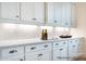 Kitchen features white cabinets, quartz countertops, subway tile backsplash, and stainless steel hardware at 1059 Sage Pine Cir, Clover, SC 29710