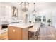 Bright kitchen features an island, pendant lighting, stainless appliances, and ample cabinet space at 1059 Sage Pine Cir, Clover, SC 29710