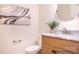 Stylish powder room featuring a marble countertop, decorative mirror, and modern fixtures; half-bath at 1059 Sage Pine Cir, Clover, SC 29710