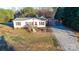 Charming single-story home with a well-maintained yard, inviting front porch, and red window shutters at 110 Dorothy Ln, Mooresville, NC 28117