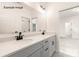 Bright bathroom features a double sink vanity and mirrors at 11009 Tyler Brook Ln # Oak0043, Mint Hill, NC 28227