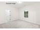 Bright bedroom features a window letting in natural light and a closet for storage at 11009 Tyler Brook Ln # Oak0043, Mint Hill, NC 28227