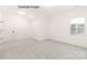Brightly lit carpeted room with window and closet at 11009 Tyler Brook Ln # Oak0043, Mint Hill, NC 28227