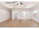 Spacious bedroom with an open entrance to the closet and a large window at 11009 Tyler Brook Ln # Oak0043, Mint Hill, NC 28227