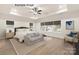 Bright, spacious primary bedroom featuring large windows and neutral décor at 11009 Tyler Brook Ln # Oak0043, Mint Hill, NC 28227