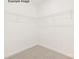 Walk-in closet provides ample storage with metal shelving at 11009 Tyler Brook Ln # Oak0043, Mint Hill, NC 28227
