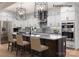 A gourmet kitchen features stainless appliances, custom cabinets, and a beautiful island with bar seating at 11009 Tyler Brook Ln # Oak0043, Mint Hill, NC 28227