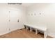 Convenient mudroom featuring a built-in bench with storage and coat hooks, perfect for organization at 11009 Tyler Brook Ln # Oak0043, Mint Hill, NC 28227