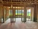 An unfinished room shows the framework of a new construction home at 11009 Tyler Brook Ln # Oak0043, Mint Hill, NC 28227