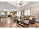 Open-concept living space featuring hardwood floors, modern decor, and seamless flow to the kitchen at 1116 S Juniper St, Kannapolis, NC 28081
