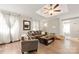 Cozy living room featuring hardwood floors, neutral tones, comfortable seating, and bright natural light at 1116 S Juniper St, Kannapolis, NC 28081