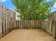 View of the deck shows fenced-in backyard at 1231 Maple Shade Ln, Charlotte, NC 28270