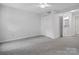 This bedroom offers a closet and an ensuite bathroom with bright neutral colors and carpet at 1231 Maple Shade Ln, Charlotte, NC 28270