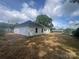 Spacious backyard with a white house and a partial view of the neighborhood at 1312 W Monroe Rd, Salisbury, NC 28144