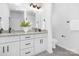 Bright bathroom featuring double vanity with granite countertops, white cabinets, and modern fixtures at 1312 W Monroe Rd, Salisbury, NC 28144