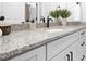 Bathroom vanity features granite countertop, white cabinets, black hardware, and elegant decor at 1312 W Monroe Rd, Salisbury, NC 28144