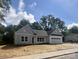 Charming single-story home with white siding, attached garage, and freshly mulched front yard at 1312 W Monroe Rd, Salisbury, NC 28144