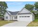 Charming single-Gathering home with a two-car garage, manicured front lawn, and lovely landscaping at 1312 W Monroe Rd, Salisbury, NC 28144