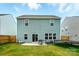 Spacious backyard with green grass, patio, trampoline, table and chairs at 133 Aspire Cir, Wingate, NC 28174
