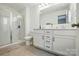 Bathroom with glass-door shower and double vanity with black hardware at 133 Aspire Cir, Wingate, NC 28174