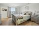 Calm main bedroom features a soothing color palette and lots of natural light at 133 Aspire Cir, Wingate, NC 28174