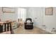 Bright bedroom features a cozy recliner, ample lighting, and soft decor at 133 Aspire Cir, Wingate, NC 28174