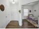 View of the bedroom featuring wood floors and an entry area to the hall at 133 Aspire Cir, Wingate, NC 28174