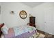 Cozy bedroom with wooden furniture, decorative art, wood floors, and a large window for natural light at 133 Aspire Cir, Wingate, NC 28174