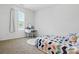 Cozy bedroom features vanity desk, soft carpet, and a patterned bed at 133 Aspire Cir, Wingate, NC 28174